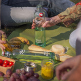 Photo of the Philos wild glass bottle being used at a picnic